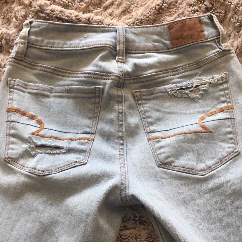 American Eagle two-toned total destructed Jeans.